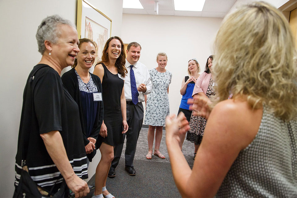 Marya Levenson is conversation with teachers and administrators from area public schools.