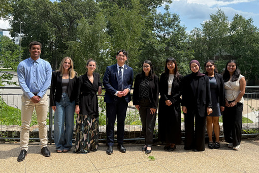Group shot of ENACT Corps members with Representative Hong and Professor Powley