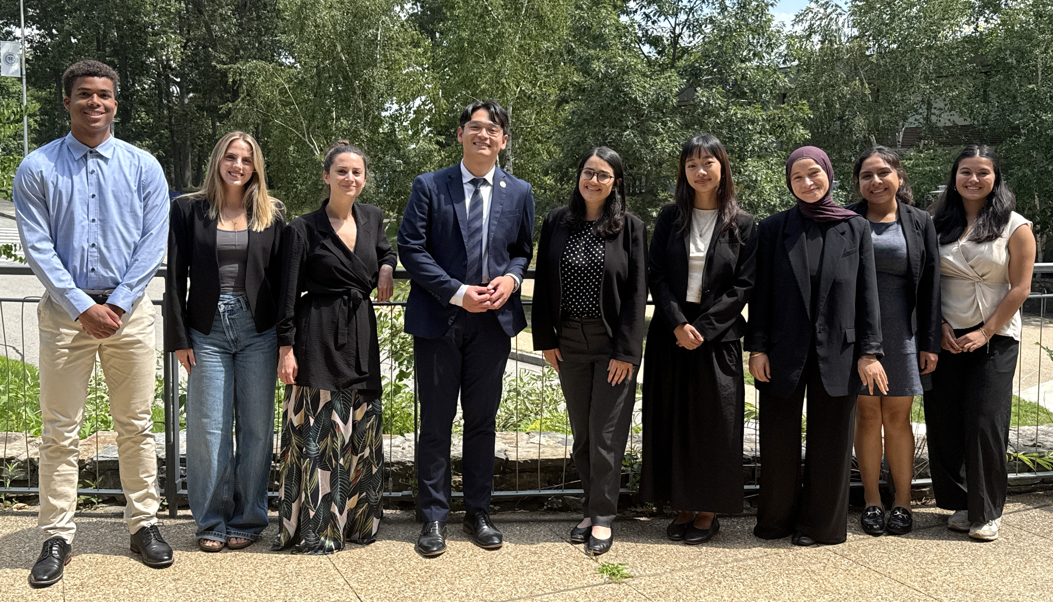picture of enact corps members standing outside with Massachusetts representative Tara Hong and professor Charlotte Powley
