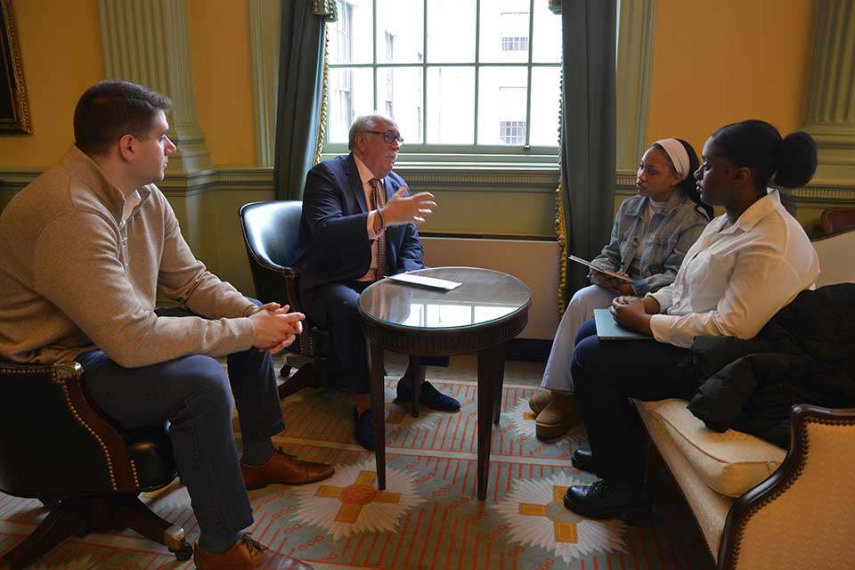 Senator Sal DiDomenico, Representative James O’Day, and Representative Jay Livingstone discuss legislation with Brandeis students