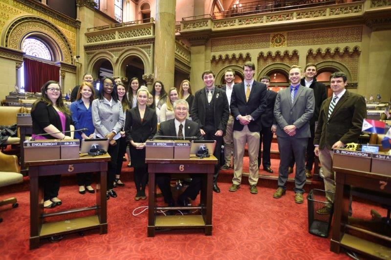 Siena College ENACT students with New York State Assemblymember Phil Steck on the floor of the New York State Assembly in 2018.