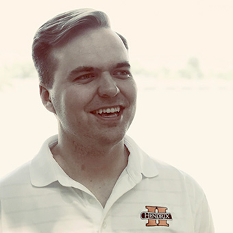 mark hickey wearing polo shirt with college logo
