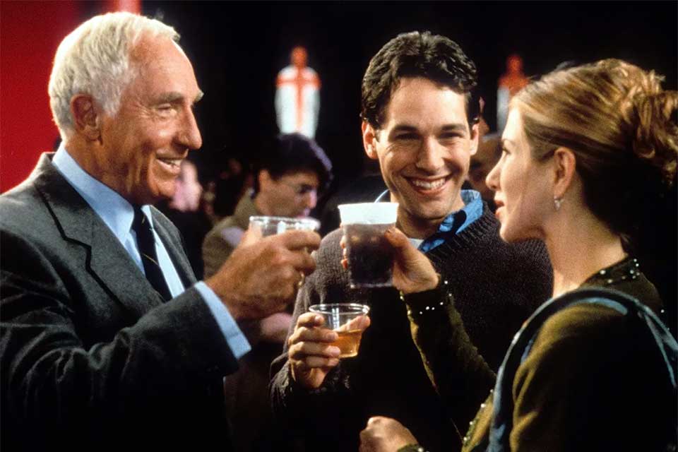 film actors acting out scene in movie - holding alcohol glasses