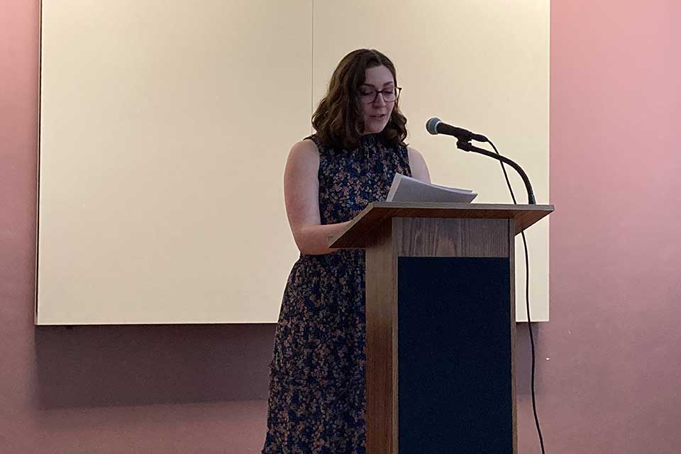 Lindsey Odorizzi reading at the podium