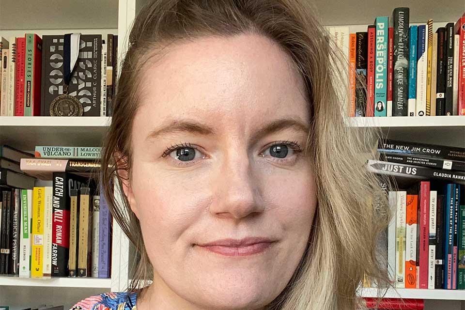 Jayne Ziemba in front of a bookshelf