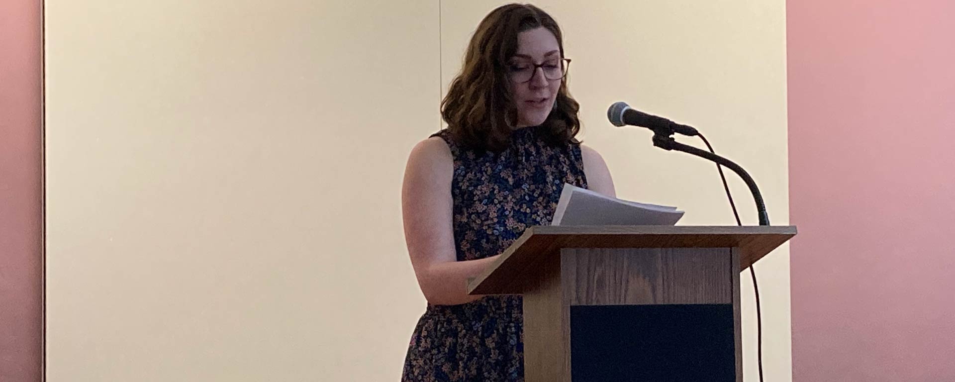 A student reading at a podium