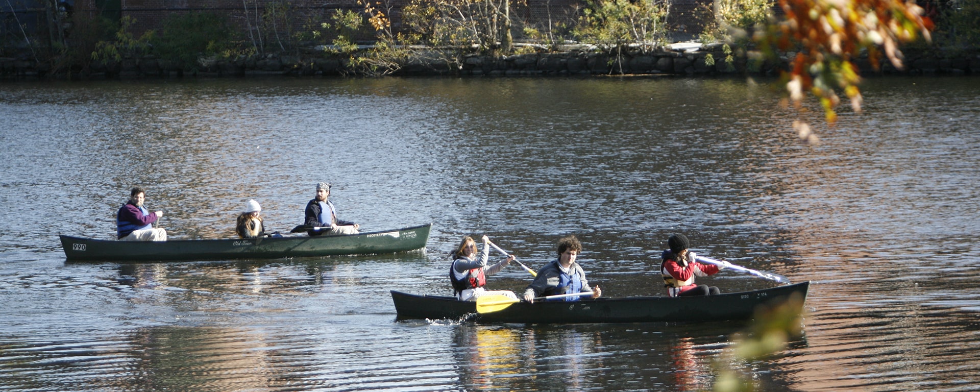 Students canoeing on the Charles River