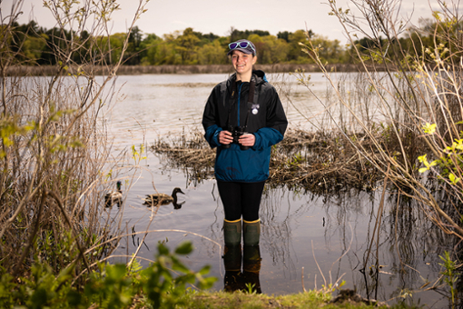 Kat Danziger stands in a river