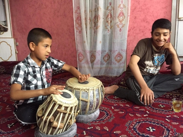 young boys playing tabla (drums)