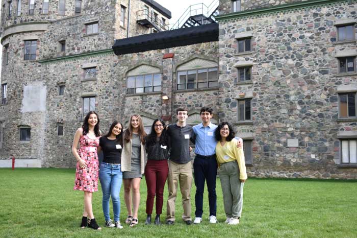 GAAA recipients standing in front of the Brandeis castle wall