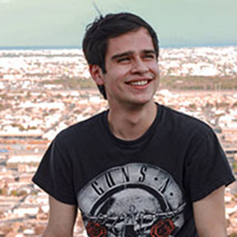 Erick Amezcua in front of a cityscape