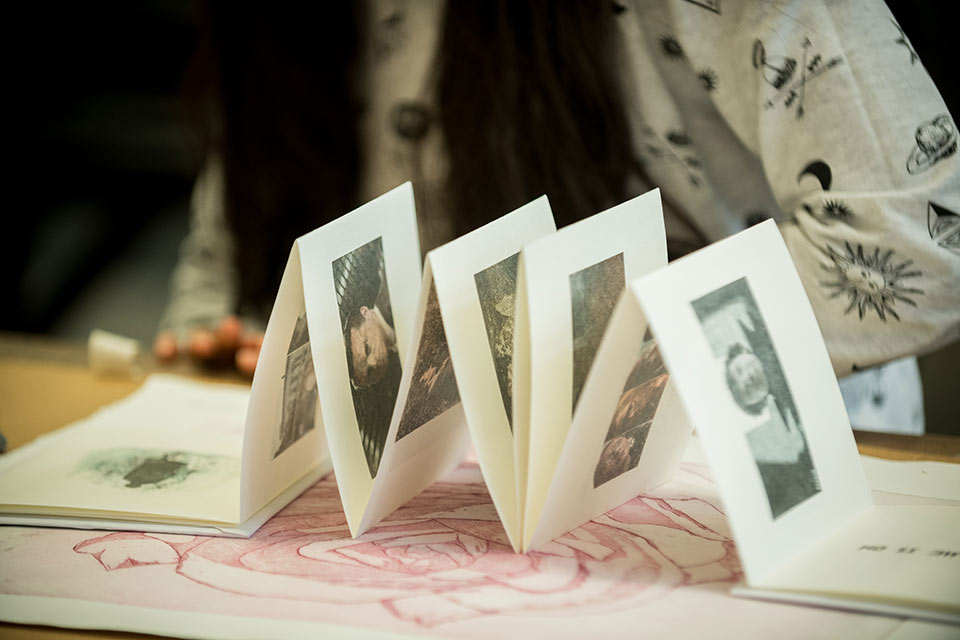 artwork in an accordion formation on a table