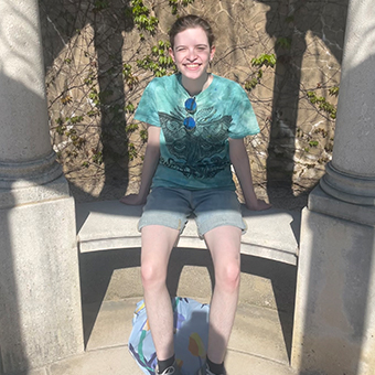 Photo of Adie Woolf sitting on a bench