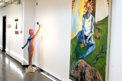 An installation photograph of an Anna Ginsburg painting, Noah McNerney sculpture, and Zoe Gale text on wood grouping.  
