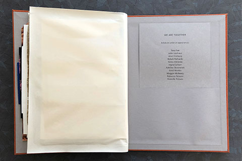 This image is the inside back cover of the book which has a pocket that holds a sheet of paper with list of artists in the order they appear in the book.