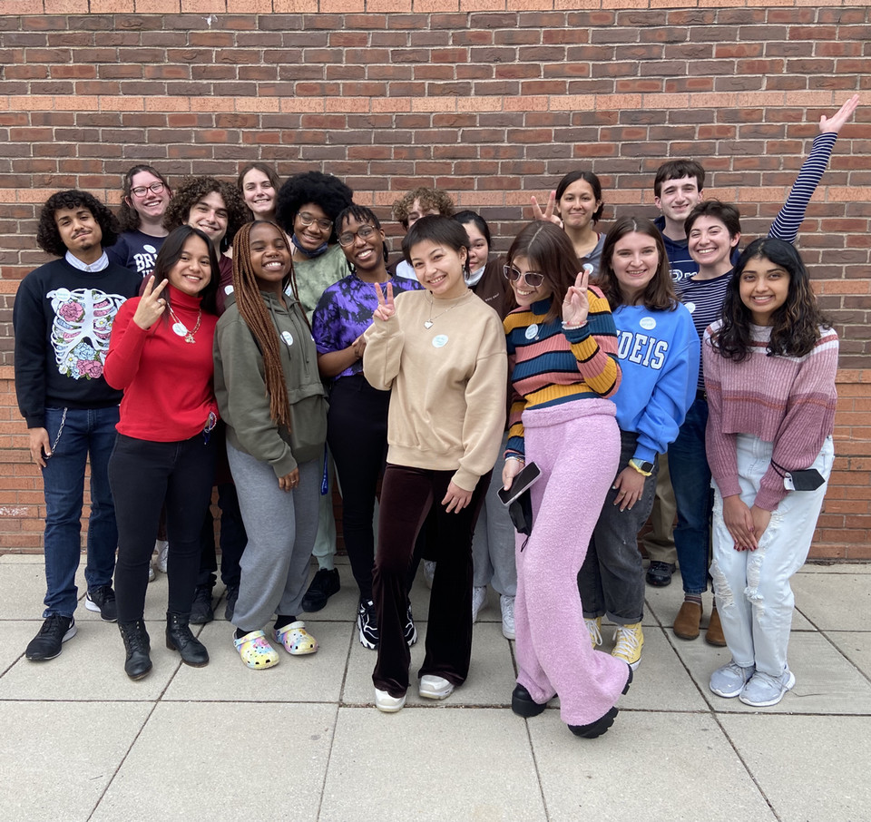 Pride Reps pose in front of a brick wall