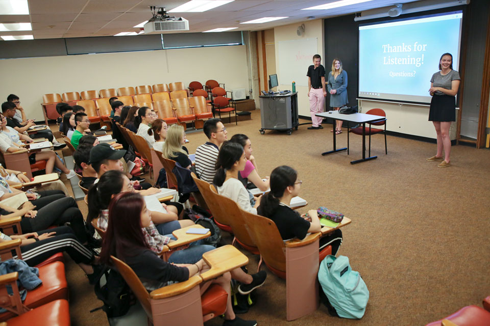 Gateway scholars listen to a presentation in a classroom
