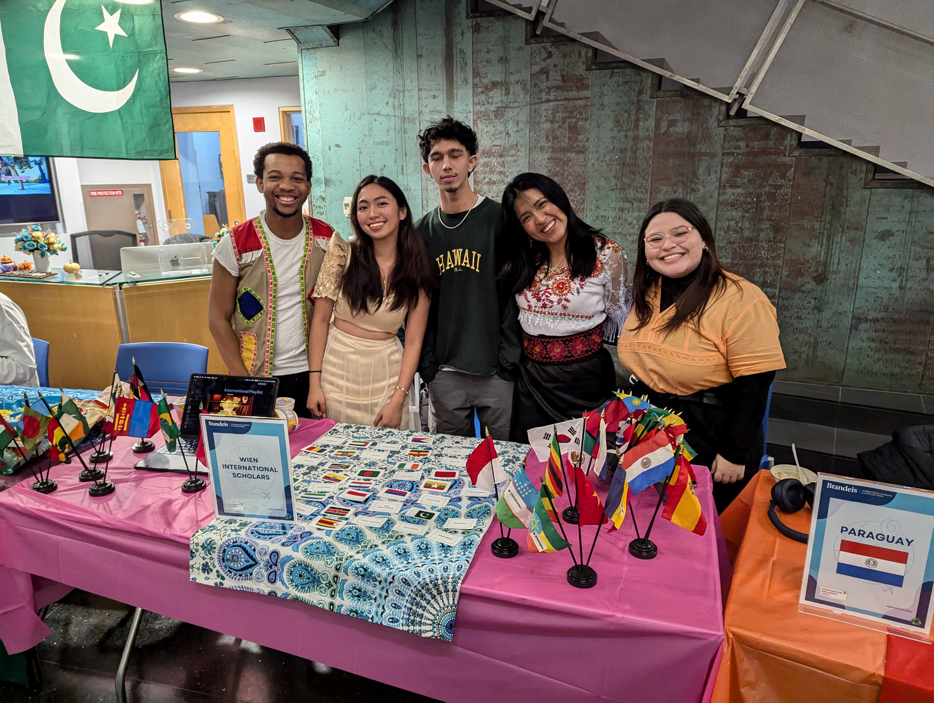Students standing in front of the Wien Scholars table at the Global Bazaar