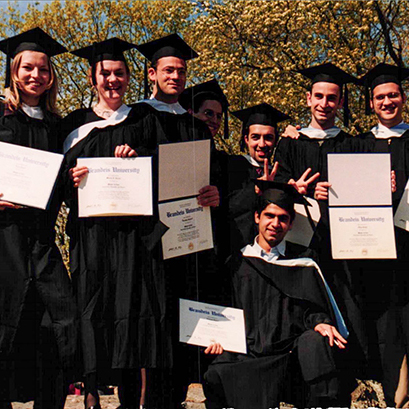 Students holding their diplomas