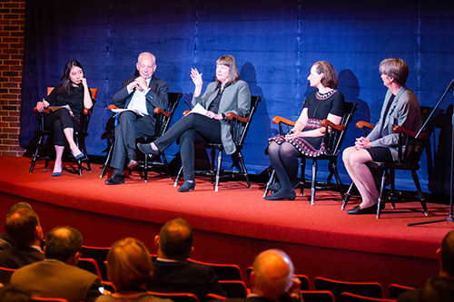 Panel of 5 people on stage