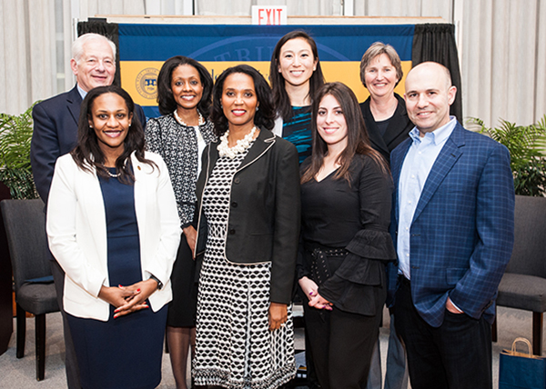 group of female leaders with former IBS dean Peter Petri, current IBS dean Kathryn Graddy, and professor Andy Molinsky