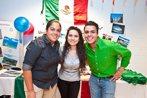 Students posing at a club fair.