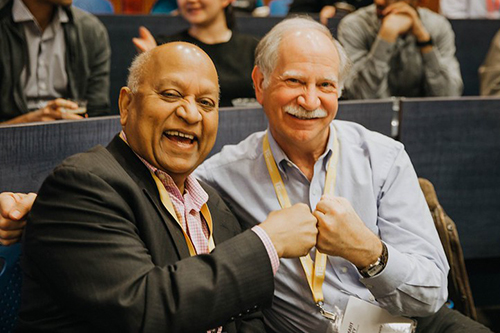 Two men fist bumping during the event.