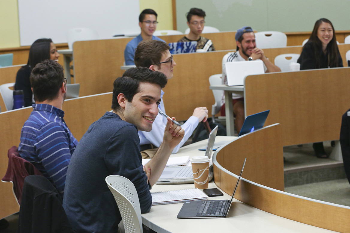 Students in classroom smiling