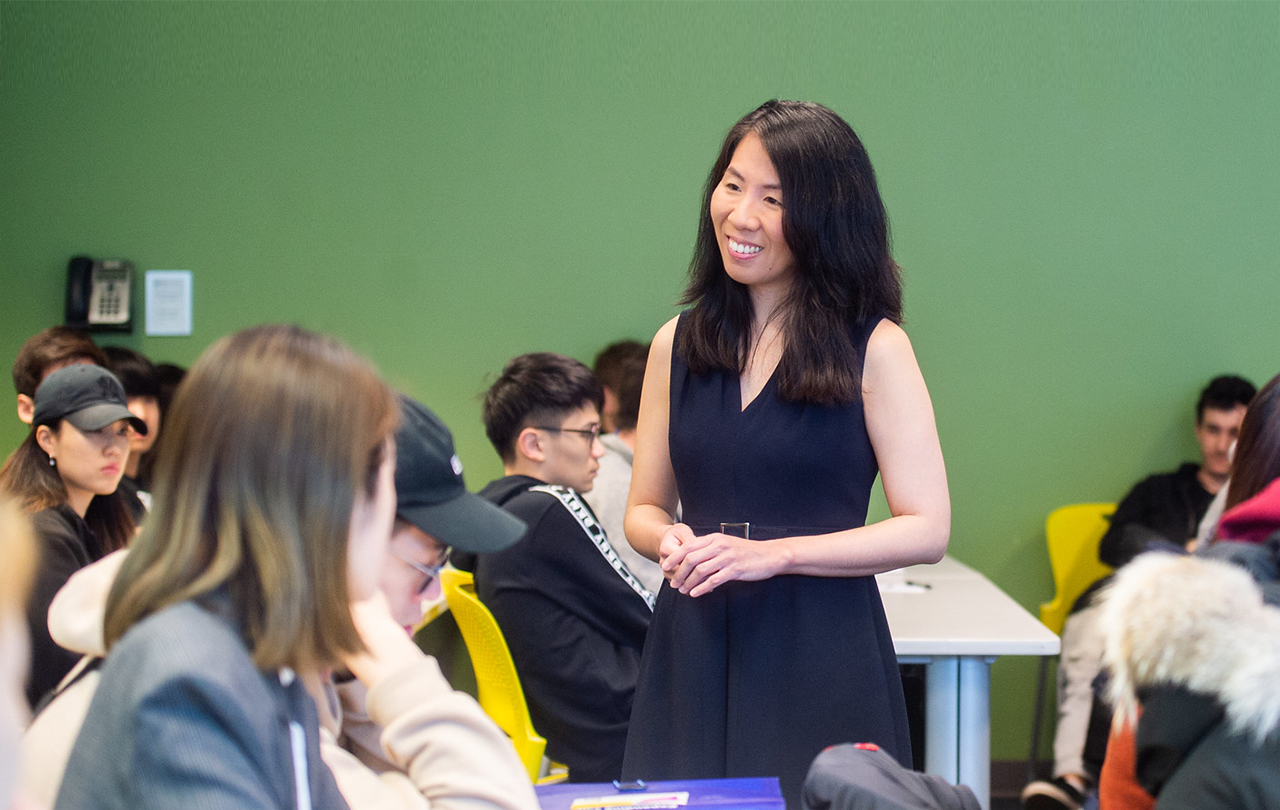 Prof. Sandra Cha speaking to her students.