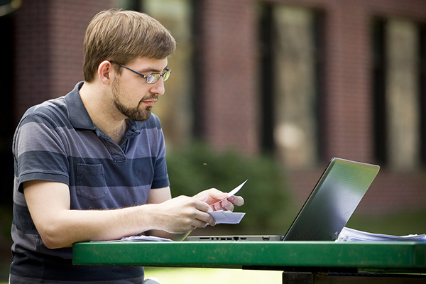 student studying outside