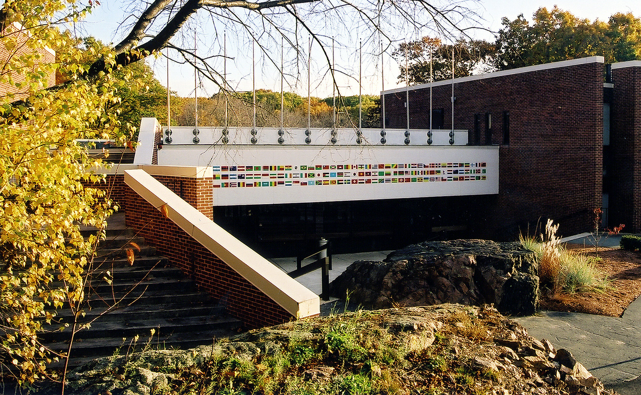the front of Sachar Building featuring country flags