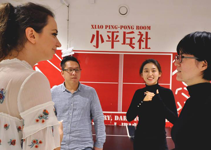 Vitanova speaking to participants in Shanghai in her pop-up gym.