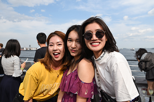 Students posing together on a cruise ship.