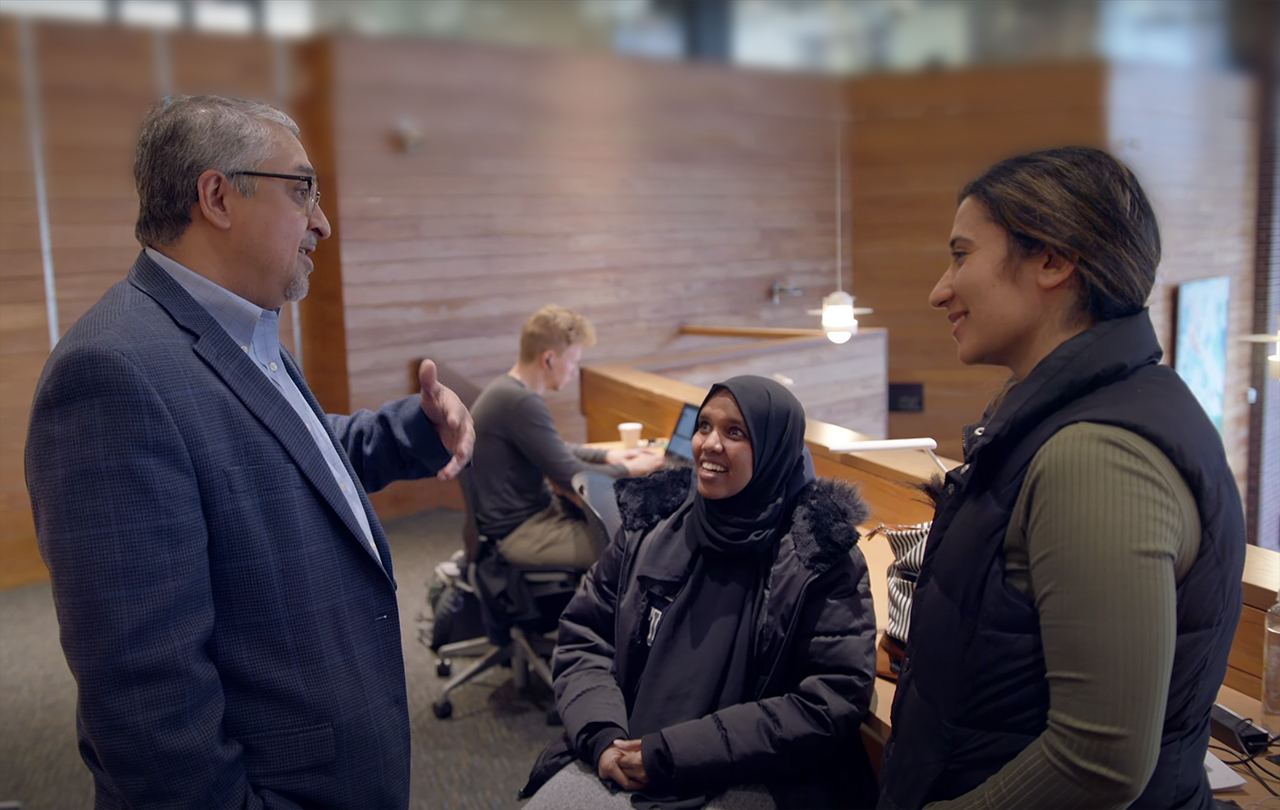 Student speaking with a recruiter at the business school