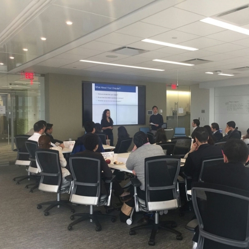 Students gather in a conference room.