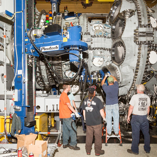 Workers with machinery in a factory