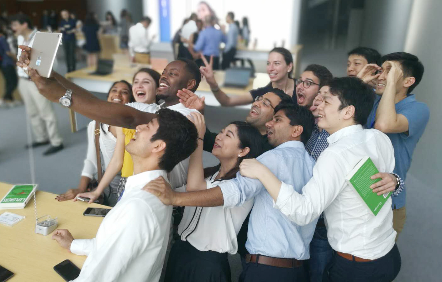 The fellows take a group photo inside the Huawei showroom.