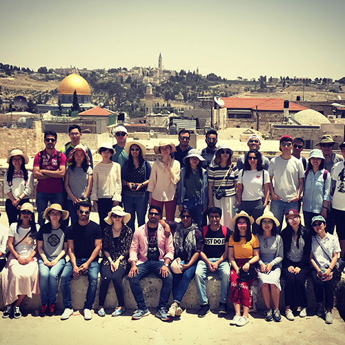 Hassenfeld fellows in Jerusalem taking in a rooftop view of the Old City.