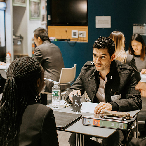 Alum interviews a student.