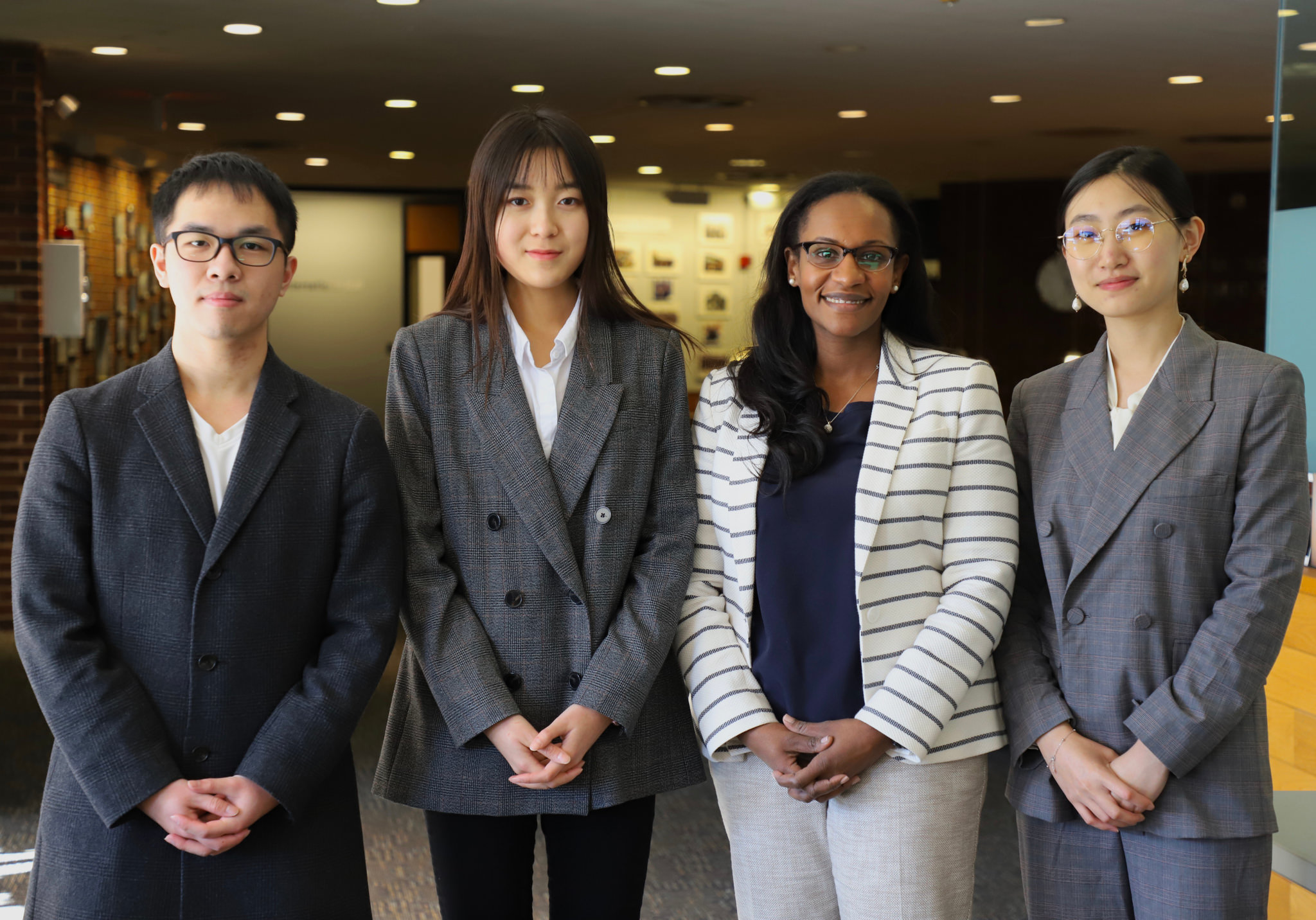 Three students with their professor.