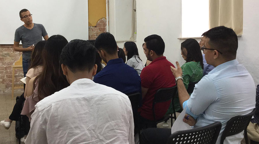 Students discuss startups at MassChallenge Israel.