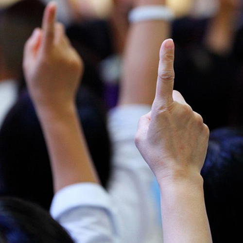 Hands raised during an auction.