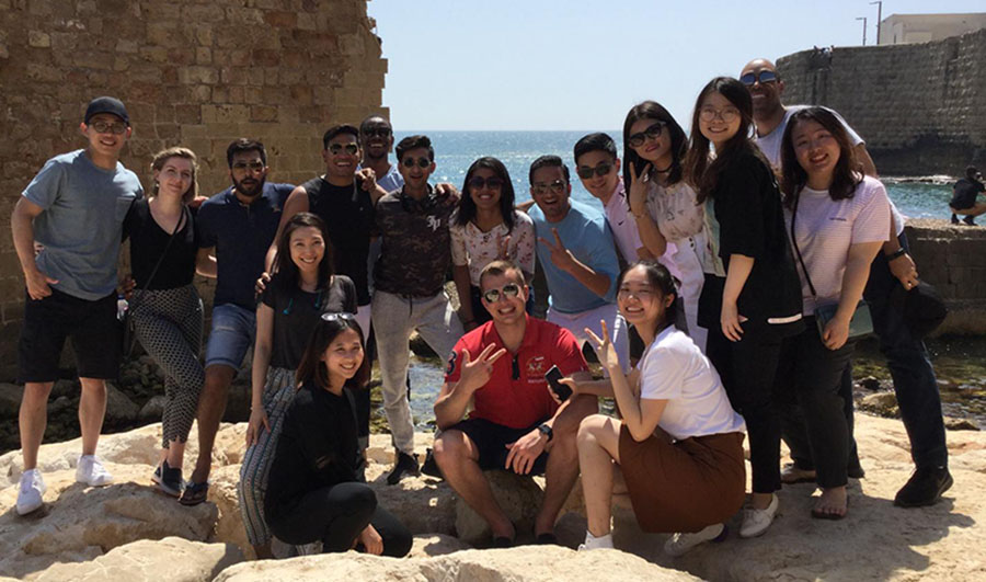 Students pose together in the town of Caesarea, Israel.