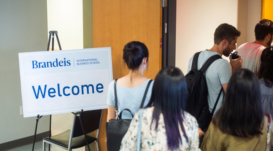 Students enter one of the orientation sessions.