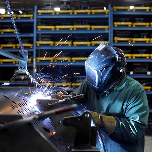 Worker in a car shop