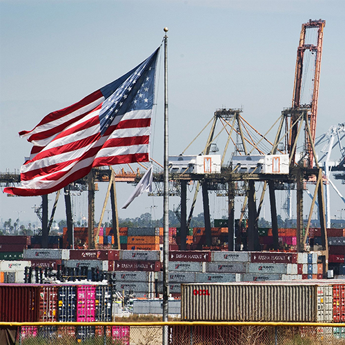 Shipping yard with an American flag.