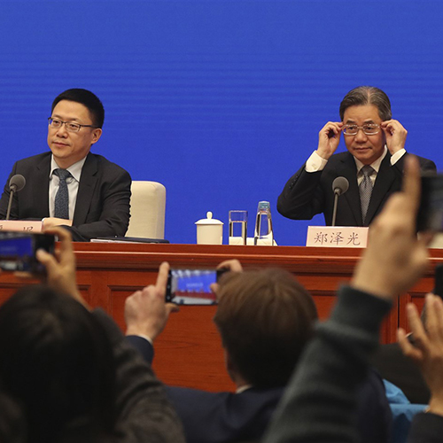 Chinese officials at a news conference.