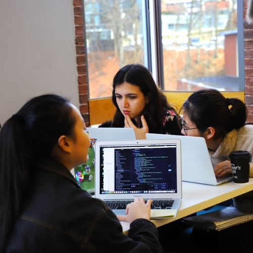 DeisHacks participants at computers.