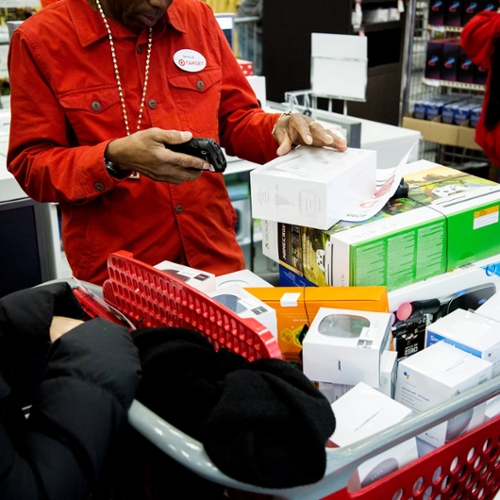 A clerk scans merchandise.