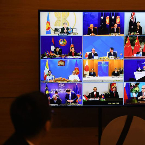 East Asian diplomats shown in a Zoom meeting on a large screen.